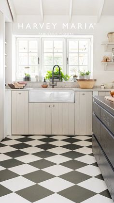 a black and white checkered floor in a kitchen