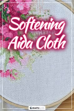 a cross stitch pattern with pink flowers and the words, softening adia cloth