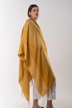 Raquel and Gregor let their Peruvian heritage of sublime textile creations guide them to craft a radiant complement for the season. Baby alpaca, cotton and rayon threads unite in a palette of yellow colors to form this splendid shawl, boasting a classic pattern and fringes—ideal for showcasing your sunny beauty. Yellow Baby, Baby Yellow, Baby Alpaca, Hand Loom, Classic Pattern, Yellow Color, Alpaca, Sunnies, Shawl