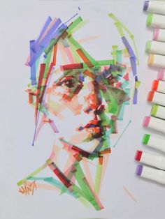 a drawing of a man's face surrounded by crayons