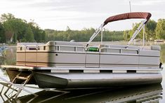 a house boat is parked on the water