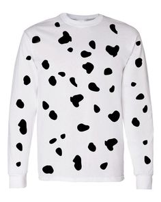 a white sweater with black spots on it