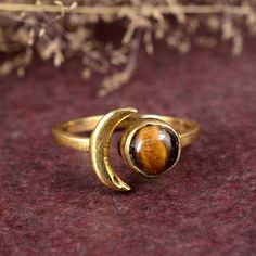 Sun Moon Tiger Eye Ring, Tiger Eye Gemstone Ring, Women Wedding Ring, Gold plated Tiger Eye Ring, Adjustable Sun Moon Ring, Daily Wear Ring, Dimension :- JEWELRY CATEGORY:- HANDMADE RING STONE NAME:- - Tiger eye STONE SHAPE:- Round PLATING:- 14k Gold Fill And Rose Gold Fill METAL: -925 Silver And Brass RING SIZE:- ALL SIZES AVAILABLE PURTY:- 925 Shipping:- All the parcels will be shipped with in 1-2 days of purchase... Payment:- We accept payment through PAYPAL only.... I make every effort to pi Ring Daily Wear, Wedding Ring Gold, Tiger Eye Ring, Women Wedding Ring, Tiger Eye Gemstone, Promise Ring Gift, Moon Ring, Tigers Eye Gemstone, Ring Stone