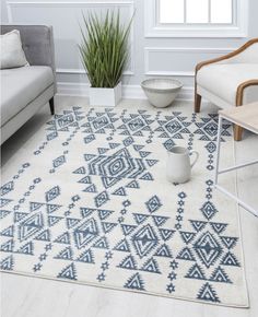 a white and blue rug in a living room