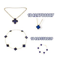 three necklaces and two bracelets with blue flowers on them, one has a gold chain