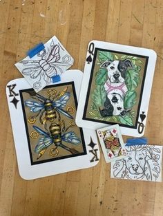 three cards with pictures of dogs and bees on them