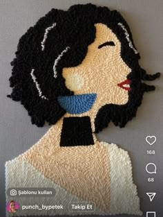 an applique made to look like a woman with black hair and blue eyes