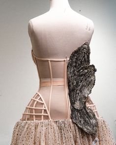 a mannequin wearing a dress made from fabric