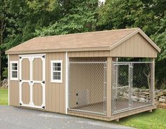 a small dog house with a fence around it