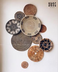 woven baskets are arranged on the wall and placed next to each other in different patterns