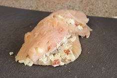 a piece of meat sitting on top of a cutting board