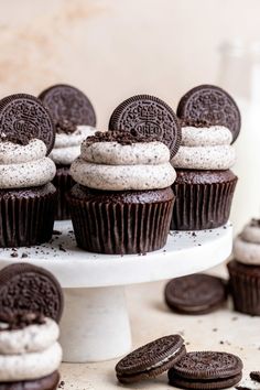 chocolate cupcakes and oreo cookies on a cake stand