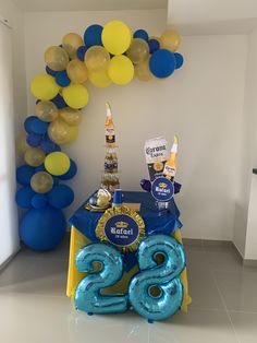 a table with balloons, confetti and decorations for a new year's eve party