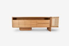 the sideboard is made out of wood and has two drawers