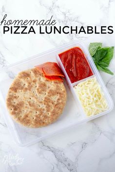 an image of homemade pizza lunchables in a plastic container on a marble table