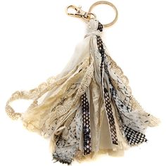 a keychain with several pieces of fabric hanging from it