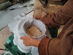 a person holding a bowl with food in it