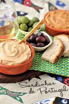 an assortment of food including bread and olives