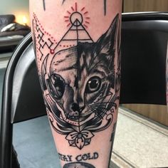 a tattoo with an image of a cat on it's leg and the words fox gold