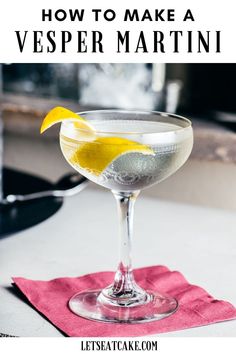 a martini with lemon wedges in it and the words how to make a vesperr martini