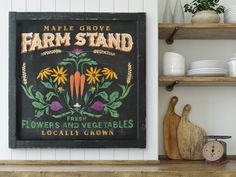 an old farm stand sign hangs on the wall next to some plates and utensils