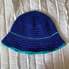 Hi! This one is also a favorite of mine, I think it's so summery and does a good job of keeping the sun out of your eyes. Fits a 22-24 inch circumference head and is very stretchy. One Size Blue Bucket Hat For Vacation, Blue One Size Bucket Hat For Vacation, Knitted Sun Hat For The Beach, Lightweight Crochet Beach Cap, Fitted Yarn Beach Hat, Summer Knitted Brimmed Hat, Blue Summer Hat One Size, Lightweight Blue Bucket Hat, Knitted Beach Sun Hat For Summer