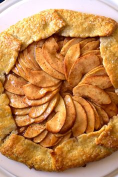 an apple pie is on a white plate