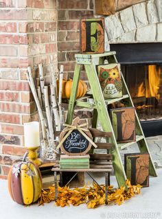 a christmas tree made out of wooden crates and other items in front of a fireplace