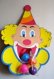 a clown mask hanging on the wall with candy