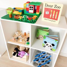 a book shelf filled with legos and toys