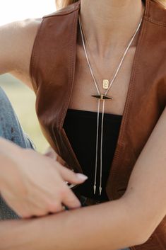 This mixed metal bolo tie-inspired necklace is a little bit country and a little bit rock & roll, and it’s sure to bring out your inner rulebreaker. Sterling Silver, Gold Vermeil, & Black Onyx 18" Long, 7" Chain Drop; Pendant 1.5" Wide Women Bolo Tie, Modern Bolo Tie, Women’s Bolo Tie Fashion, Bolo Tie Outfit, Bolo Tie Women Outfit, Tie Women Outfit, Tie Outfit, Bolo Necklace, Winter Jewelry