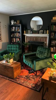 a living room filled with furniture and a fire place next to a book shelf full of books