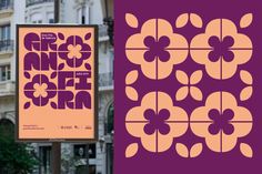 an advertisement is displayed on the side of a building with purple and orange flowers in it