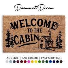 a welcome mat with the words welcome to the cabin and an image of a house