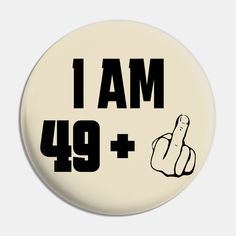 a button with the words i am 94 and a hand pointing up to the right