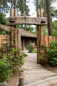 a wooden sign that says alaska on it