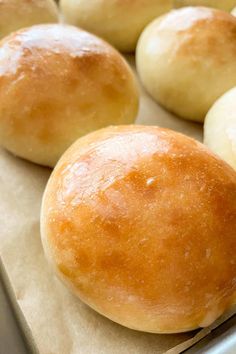 bread rolls on a baking sheet ready to be baked in the oven or used as an appetizer