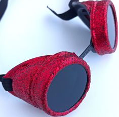 Hand painted ! Hi quality, by ZHOS! The goggles made from plastic, with adjustable elastic strap. These are modified welding goggles! Psytrance Glasses made from quality plastic. Color is  Red - glitter painted  . Lenses are grey-green and protecting against UVA and UVB rays diameter 50 mm (2 inch). Good for festival , concert , Christmas party, Cosplay , Anime ,Larp , fashion ect. Shipping: We ship within 1-2 business days after cleared payment. We will post you tracking number once the item is shipped.Please contact us with any questions or requests. Combined shipping discounts available. Please ask us before making purchase. All items are already in stock in the USA .  I have sent the masks and goggles to a warehouse in the US and only then do I posted on Etsy. . Usually it takes about Techno Glasses, Red Steampunk, Larp Fashion, Steampunk Glasses, Welding Goggles, Steampunk Goggles, Festival Concert, Glitter Paint, Red Glitter