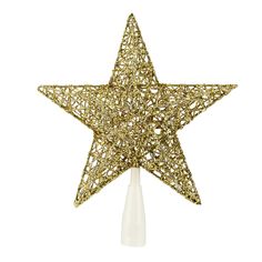 a gold star ornament on a white background