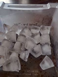 ice cubes are sitting in an ice bucket