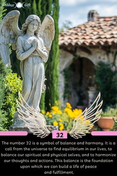 an angel statue sitting in the middle of a garden next to a building with words above it