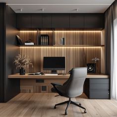 an office with a desk, chair and computer monitor on the wall in front of it