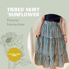 a woman is wearing a skirt with sunflowers on it and the words, tiered skirt pattern instructions