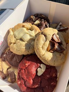 a box filled with different types of cookies