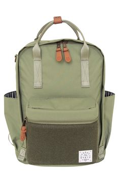 a green backpack with two brown handles