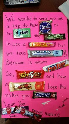 a pink paper with candy bars on it