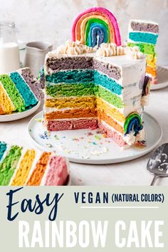 a rainbow cake on a plate with the words easy vegan natural colors in front of it