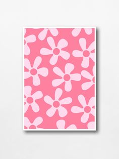 a pink and white flower print on a wall