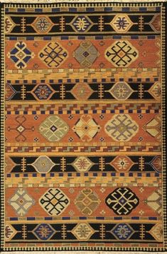 an orange and black rug with geometric designs