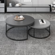 two coffee tables sitting on top of a carpeted floor